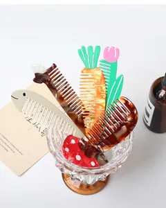 Close-up of cute animal and plant shaped acetate hair combs in a glass display