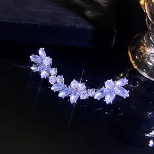 Macro shot of silver leaf hair clip with marquise zirconia and sparkling starburst effects
