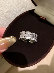 Detailed macro view of an elegant zircon lace open ring presented in a velvet jewelry box