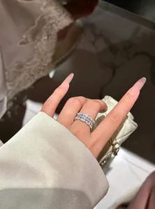 Elegant zircon lace ring worn on finger featuring a delicate floral and luxurious design