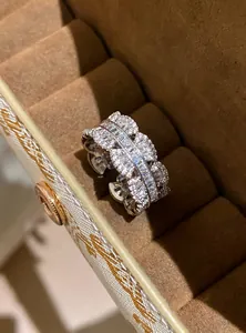 Detailed macro view of a lace-edged sparkling zircon open ring in a velvet jewelry box.