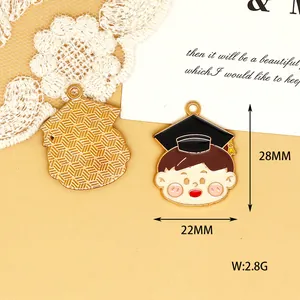 Detailed macro view of graduation boy enamel charm including dimension measurements