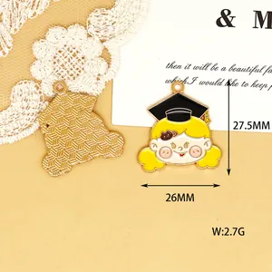 Detail view of a cute enamel girl graduation charm with dimensions 27.5mm by 26mm.