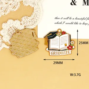 Detail of alloy enamel graduation charm featuring a book and cap design with dimensions.