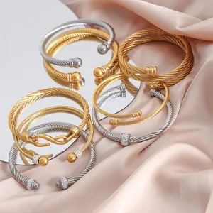 Luxurious gold and silver cable twist bangles with sparkling zircon accents for women