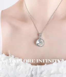 Close-up of a luxury round crystal pendant necklace with bright silver finish on a model