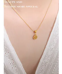 Detail of 18k gold plated necklace featuring a hollow Double Happiness囍 pendant