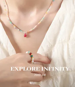 Detail of bohemian handmade beaded necklace and pearl ring with colorful natural stones