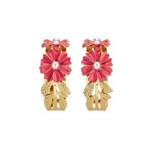 Elegant gold-tone daisy cuff bracelets with pink enamel petals and pearl center