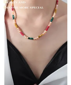 Detail of freshwater pearl and colorful cylindrical gemstone beaded choker necklace