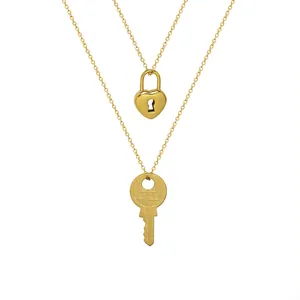 Golden titanium steel heart lock and key pendant necklace set for couples on white background