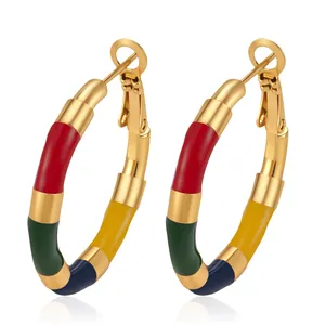 Close-up of colorful enamel bamboo-style stainless steel hoop earrings in vibrant segments