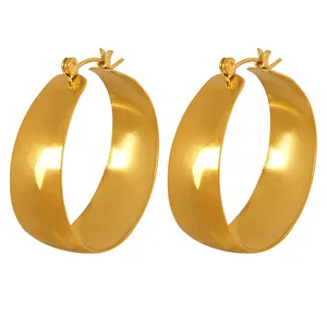Polished 18k gold plated stainless steel chunky hoop earrings for women on white background