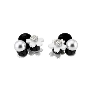 Elegant small floral claw clips with pearls and rhinestones for side hair styling.