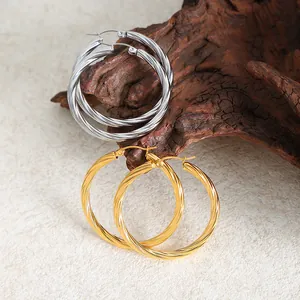 Titanium steel twisted hoop earrings in gold and silver finish with spiral design