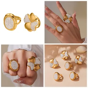 Detailed macro of 18k gold plated stainless steel clover ring with pave crystal stones