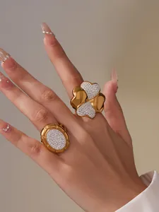 Detail of 18k gold plated stainless steel clover ring with sparkling crystals on hand