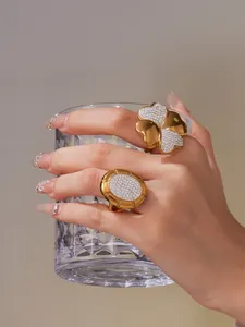 Detail of 18k gold plated four-leaf clover ring with micro-pave crystal zircons
