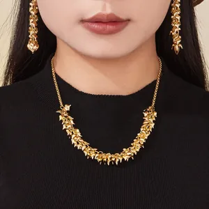 Elegant 18k gold-plated multi-heart pendant necklace set on a professional female model