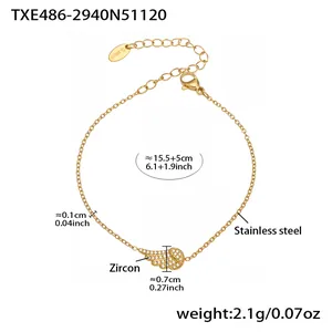 Detail of wing-shaped zircon bracelet with measurements and gold-plated stainless steel texture