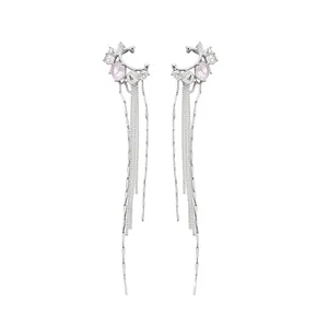 Elegant silver-toned ear cuff featuring long tassels and purple star-like gems