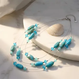 Detail view of Bohemian three-layer necklace with blue turquoise and crystal beads