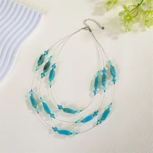 Bohemian three-layer turquoise crystal beaded necklace for beach wear.