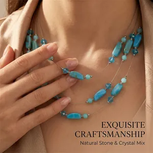 Close-up detail of a three-layer bohemian necklace with blue natural stones and faceted crystals