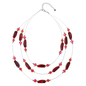 Detailed view of bohemian triple-layered necklace with red resin and crystal beads