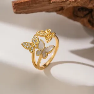 Macro view of elegant micro-set zircon butterfly ring with white pearlescent inlay detail