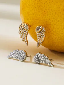 Detailed view of gold and silver angel wing stud earrings with 5A cubic zirconia stones