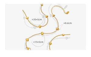 Detailed view of gold-plated heart necklace and bracelet set with dimension specifications
