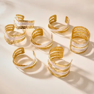 Bohemian multilayer open cuff bracelets in 18k gold and silver with hammered texture