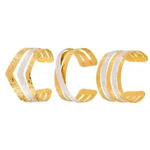 Set of three stainless steel multi-layer cuff bracelets in gold and silver tones