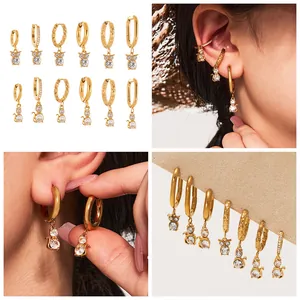 Detailed view of 18k gold plated cat and owl earrings with sparkling crystals