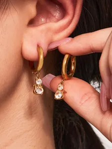 Detail of 18k gold plated cat hoop earrings featuring sparkling round cubic zirconia stones