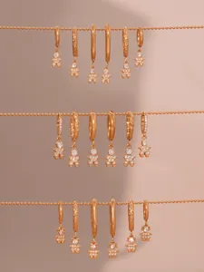 Detail of rose gold astronaut earrings with 5A cubic zirconia stones and pavé setting