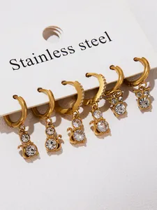 Detailed macro view of 18k gold plated cat earrings set with sparkling zircon stones