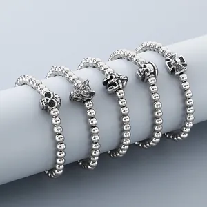 Detailed view of 6mm stainless steel beaded bracelets with skull and wolf charms