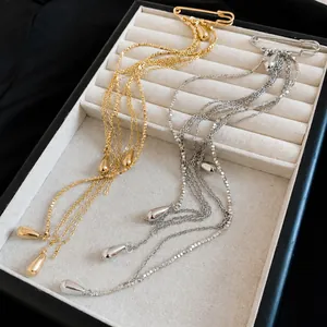 Elegant minimalist metal tassel safety pin brooch with water-drop charms in gold and silver finish