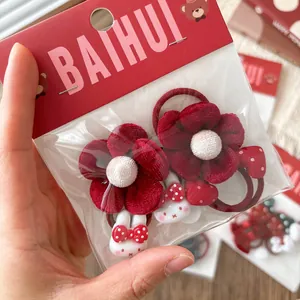 Set di due elastici per capelli rossi con fiori in tessuto e fiocchi di coniglio