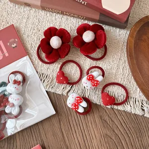 Set da 6 elastici per capelli rossi con fiocchi e fiori per bambine su carta orso