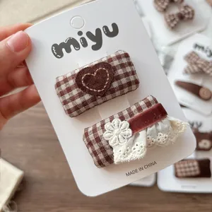 Plaid fabric hair clips set with brown heart embroidery and lace details for girls
