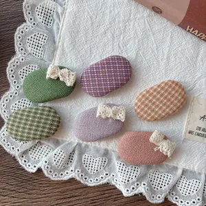 Set of 6 mini plaid and lace bow hair clips for girls on a white vintage fabric