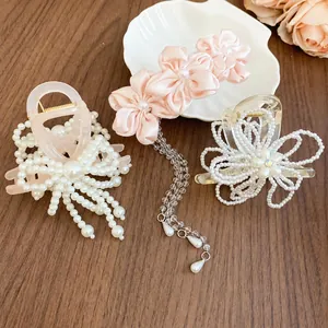 Elegant set of Korean style pearl flower and bow hair clips and claws for women