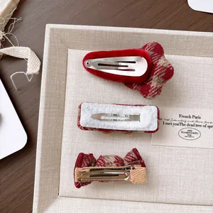 Three-piece set of red and khaki plaid bow hair clips with star and rectangle shapes