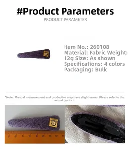 Detailed view of the 8cm purple fabric hair clip with a gold smiley face square accent