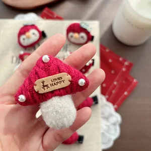 Cute red mushroom hair clip with knitted texture and pearl details for girls