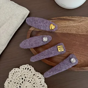 Set of four purple tweed BB hair clips with gold heart charms and sparkling crystals