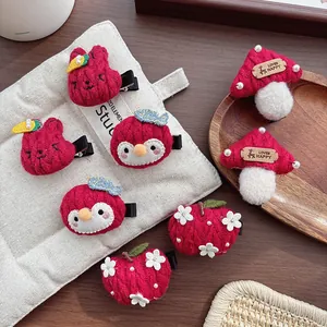 Detailed view of handmade knitted mushroom and rabbit hair clips for girls with pearls